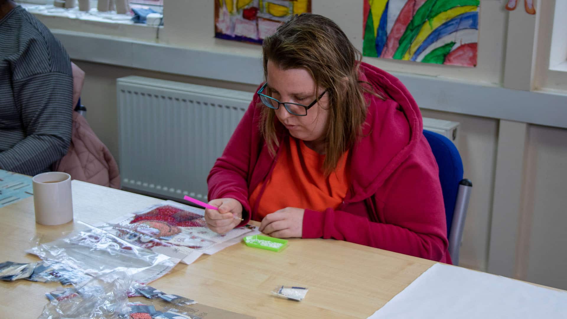 Service users working in the arts and crafts room