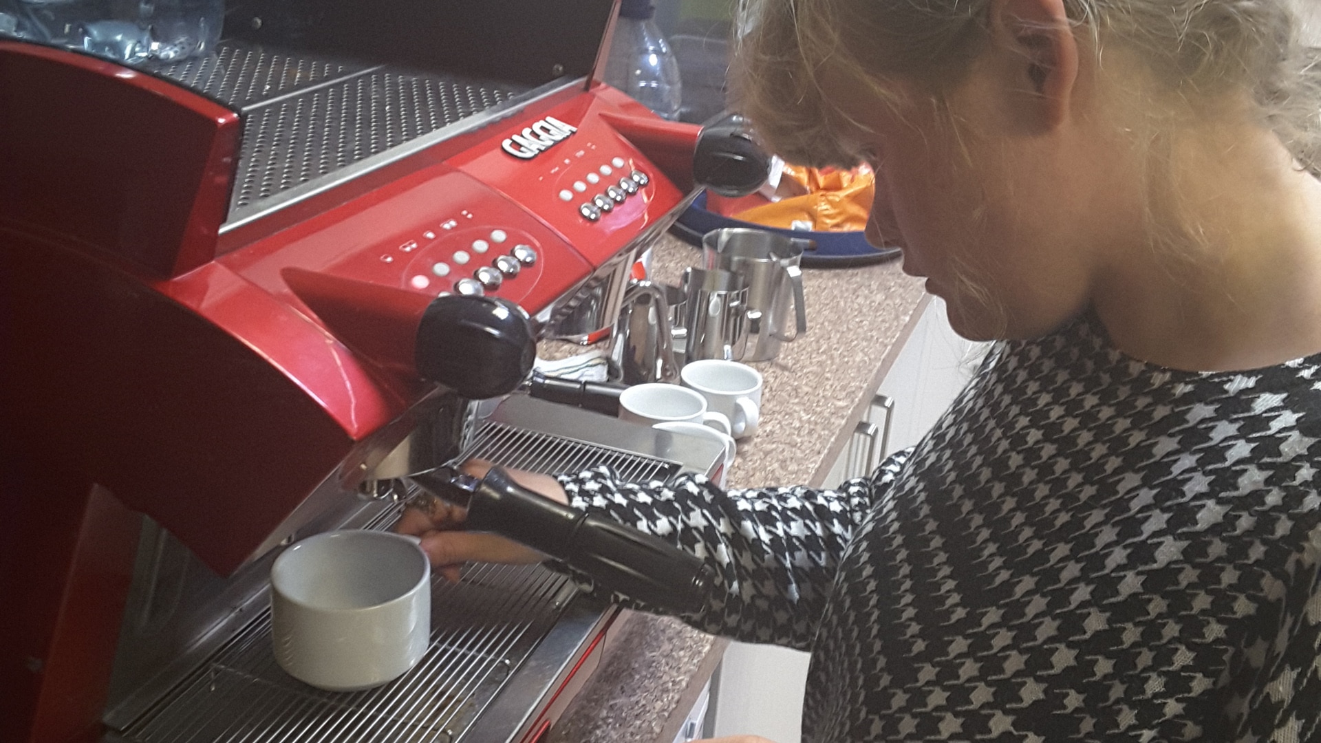 Magpies member using a coffee machine